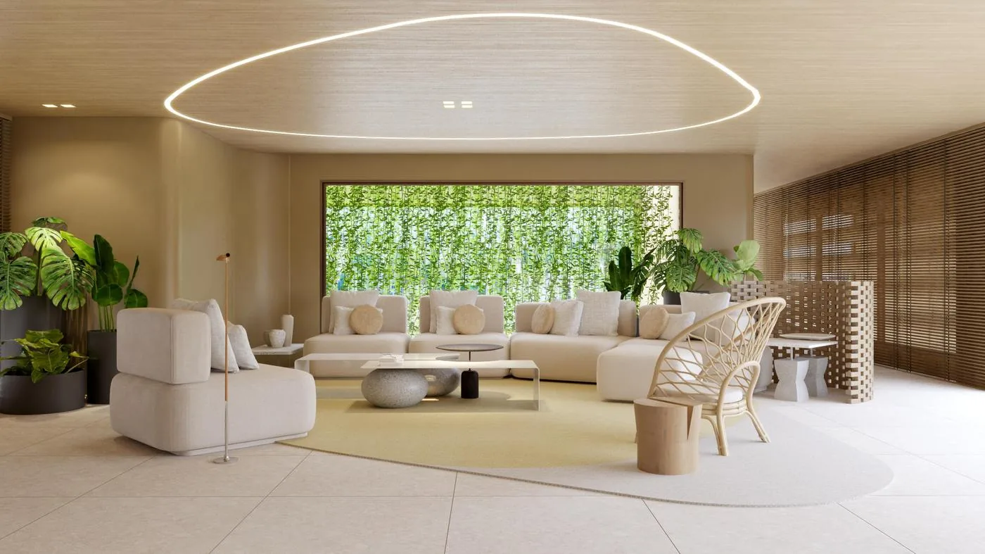 Lobby com sofás e parede verde